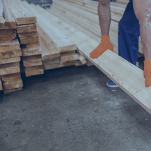 Male builder hands in work gloves holding wooden plank